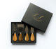 Luxury corporate gift box featuring an acacia serving board, wooden-handle cheese knife set, gourmet olives, and artisan chocolates, arranged in a black gift box with black ribbon.