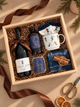 A cozy winter escape in a box, made for slow mornings, snowy weekends, and après-ski evenings. This festive collection pairs a bottle of French Door red wine with TALLU Après Ski hand wash and candle, a charming ski-themed mug, cozy ski socks, and a soft woven tea towel.