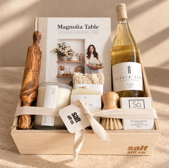 SALT Gift Co. curated home and hosting gift box featuring French Door wine, Magnolia Table cookbook, TALLU rose candle, Sō lemon and poppy soap, natural spa saver and handcrafted wooden kitchen accessories.