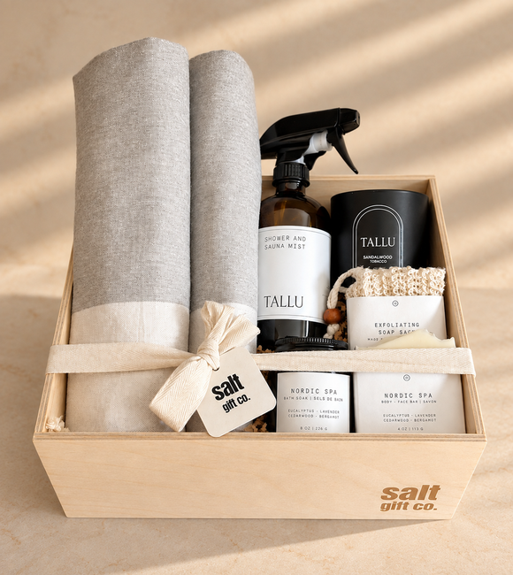 Vancouver self-care spa gift box featuring soft neutral towels, TALLU shower and sauna mist, sandalwood candle, exfoliating soap, Nordic Spa bath soak and body bar, beautifully presented in a wooden SALT Gift Co. box.