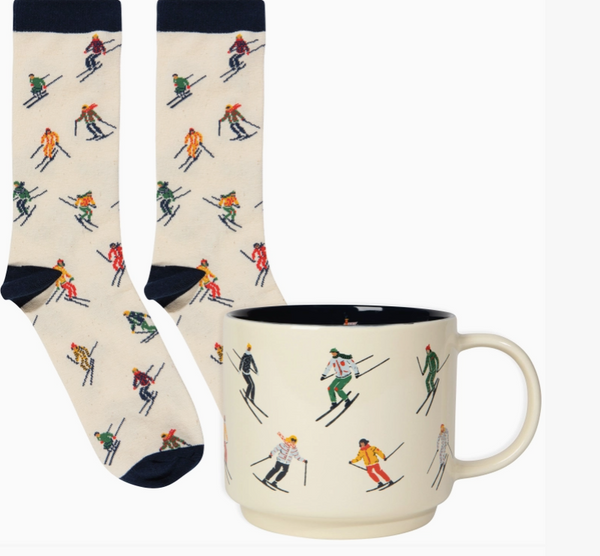A cozy winter escape in a box, made for slow mornings, snowy weekends, and après-ski evenings. This festive collection pairs a bottle of French Door red wine with TALLU Après Ski hand wash and candle, a charming ski-themed mug, cozy ski socks, and a soft woven tea towel.