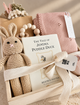 Vancouver baby girl gift box with knitted bunny, Beatrix Potter book, blue baby blanket and curated newborn gifts.
