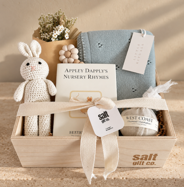 Welcome Baby, Vancouver baby boy gift box with knitted bunny, Beatrix Potter book, blue baby blanket and curated newborn gifts.